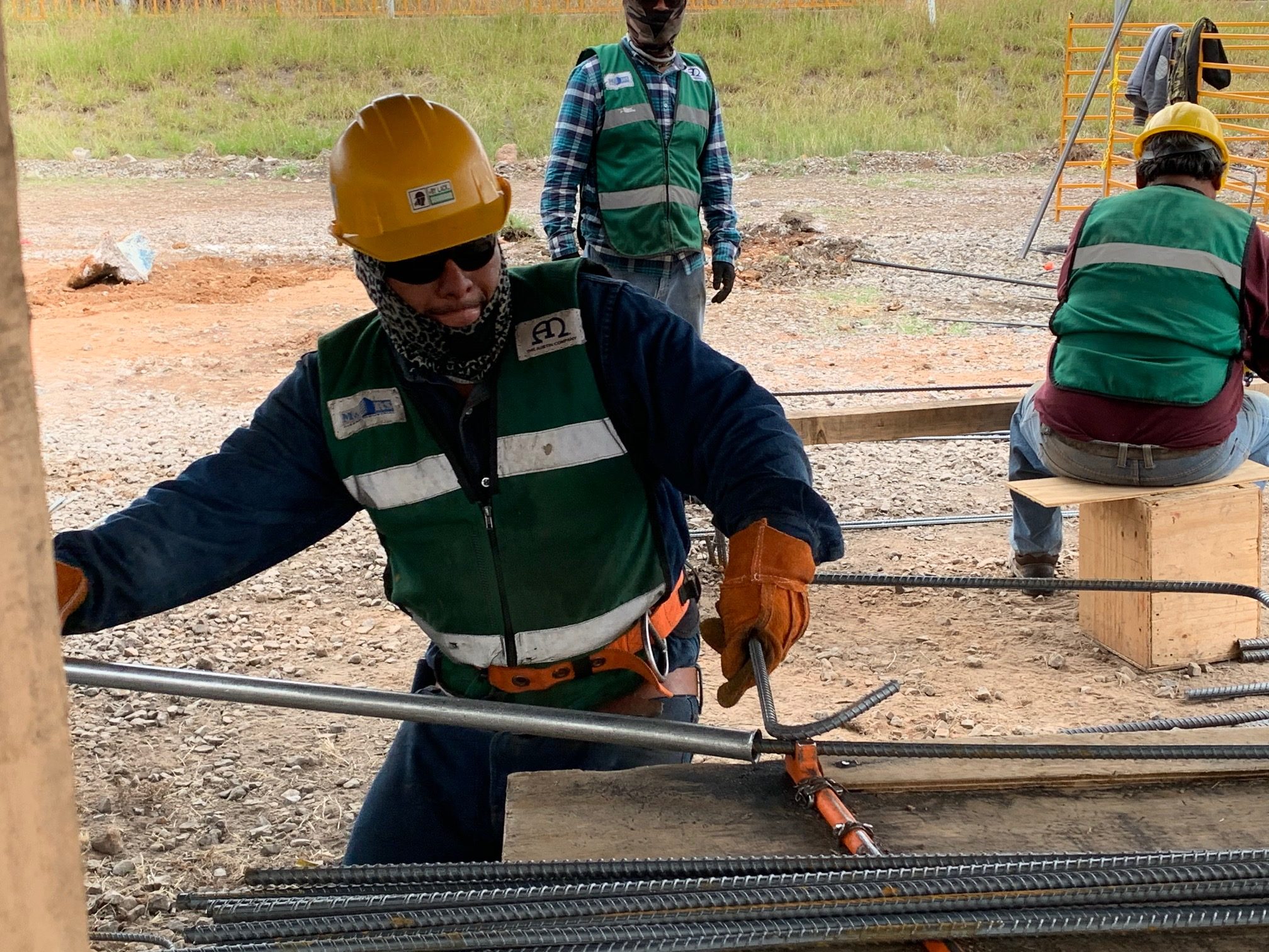 construction worker bends rebar